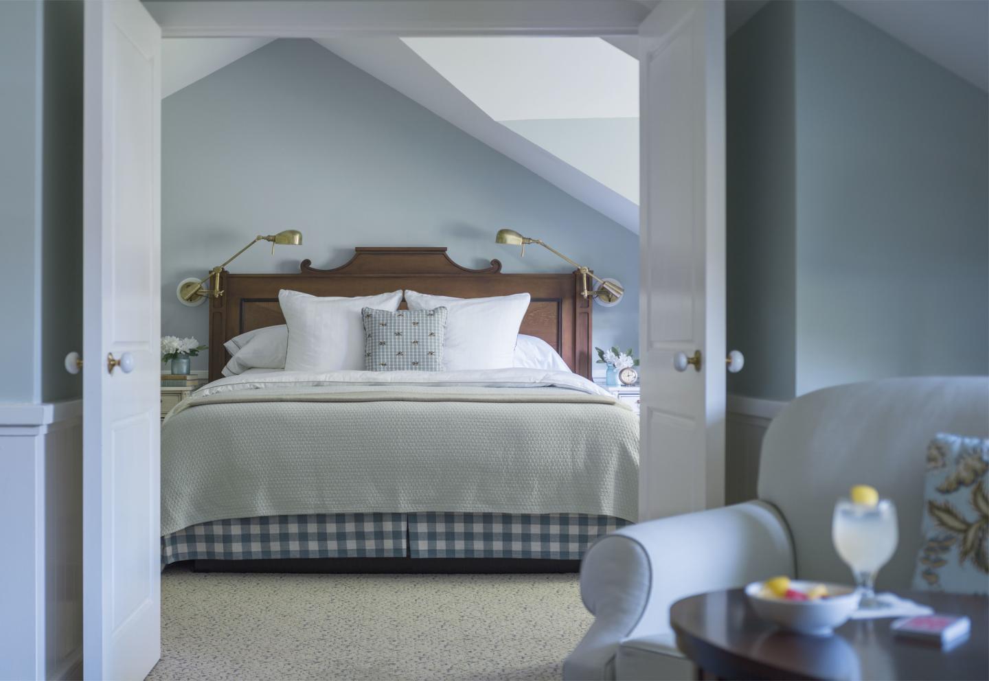 Tavern Suite with light blue walls, and gentle lighting.
